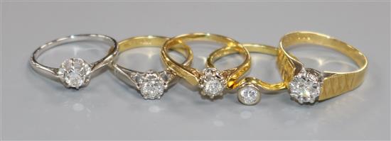 Five 18ct gold and solitaire diamond rings, including three illusion set and one in white gold setting.